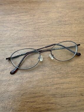 George NB 200 oval-shaped, full-rim metal frames in a brown finish